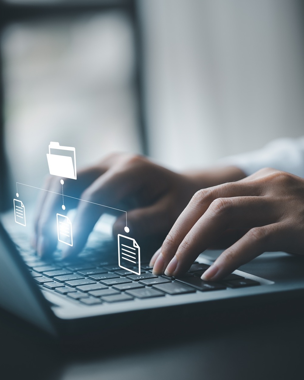 business man typing on a keyboard with holograms of digital document files, data files on computers stored as cloud databases can be viewed online and prevented data loss from the device.